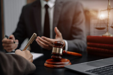 Business people and lawyers discussing contract papers sitting in the table at office in the morning. concepts of law, advice, legal services.