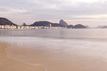 Fototapeta na wymiar Dawn on Copacabana beach in Rio de Janeiro.