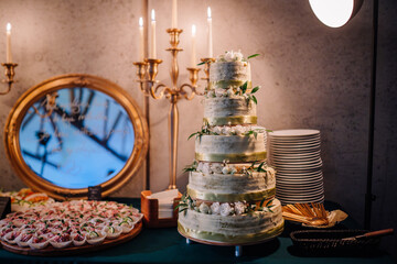 dessert table with wedding cake