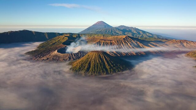 4K Hyperlapse aerial view flying to mount Bromo active volcano above sea of clouds, Java, Indonesia 
