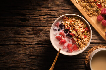 A cup of milk with bowl of oat granola with fresh milk and berries for healthy breakfast. Vegeterian, dieting and weight loss concept.