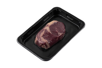 Vacuum-packed steak on a white background. A piece of vacuum-packed beef close-up on a white background.