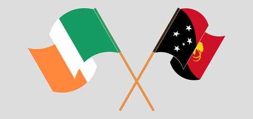 Crossed and waving flags of Ireland and Papua New Guinea