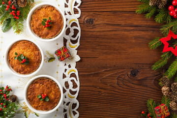 Small, baked patties in Christmas retro styling. Top view. Natural wooden background.