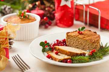 Small, baked patties in Christmas decoration. Front view.