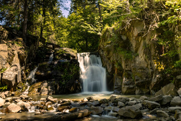 Beautiful view of the Zaskalnik waterfall in the Pieniny Mountains. Szczawnica. Long exposure.