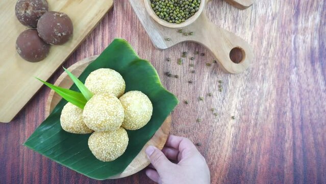 Sesame seed balls or onde onde is a traditional food from Indonesia made of glutinous rice flour green beans sesame seeds brown sugar served in a plate