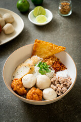 spicy small flat rice noodles with fish balls and shrimp balls without soup