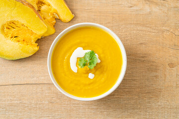 pumpkin soup in white bowl