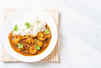 Shrimps in curry sauce on rice