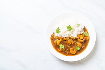 Shrimps in curry sauce on rice