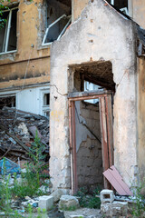 old broken door of a destroyed house in Ukraine