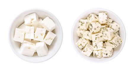 Greek feta cubes, brined cheese, in white bowls. Cheese, matured in brine, with soft, moist...