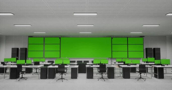 Big Green Screen Horizontal Mock Up In A Control Security Center Room With Many Green Screen Mock Up Computers On Tables At The Office
