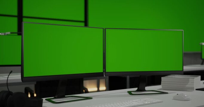 Close Up Of Two Mock Up Green Screen Desktops On The Tables In Front Of Big Green Screen Horizontal Mock Up In A Control Security Center Room At The Office
