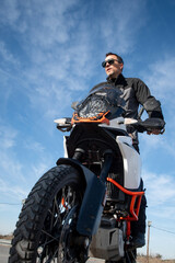 Vertical photograph of motorcycle instructor with contrapposto shot