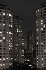 Fototapeta na wymiar skyscrapers at night, apartments in korea
