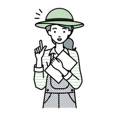 立って書類を手に持って何かひらめいた農家の女性