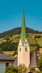 Fototapeta na wymiar Church on a sunny summer day at Niederau, Wildschoenau, Tyrol, Austria