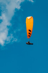 Alpine summer view with a paraglider at Mount Markbachjoch, Niederau, Wildschoenau, Tyrol, Austria