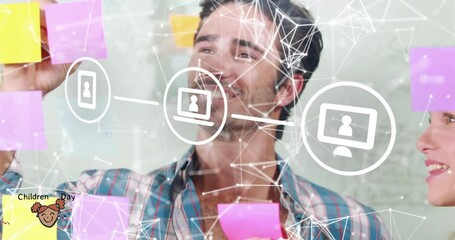 Animation of laptop, computer, cellphone icons over caucasian colleagues discussing over notes - Powered by Adobe