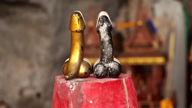 Wooden penis in Princess cave (Phra Nang Shrine Temple). South Railay beach in Krabi. Thailand.
