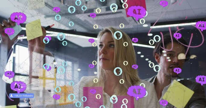 Animation of connected people and ai icons over diverse woman with man sticking note on glass wall