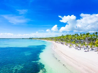Deurstickers Landschap Beautiful tropical beach with white sand and palm trees. Turquoise water and blue sky. Summer vacation in the all inclusive resort and hotel