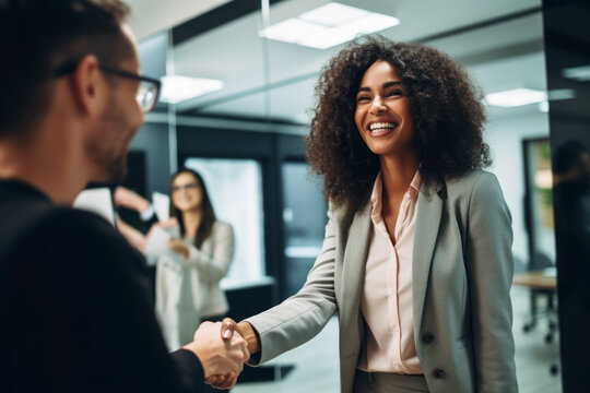 African American Woman Shaking Hands With A Man In Business Center. Photorealistic Illustration Of Generative AI.