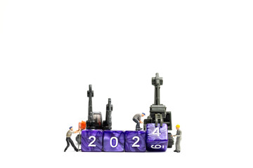Miniature people , Worker team flips a block with the number 2024, On a white background
