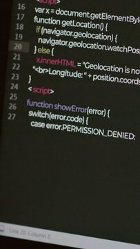 Vertical no people close up of computer screen with code creation process going on