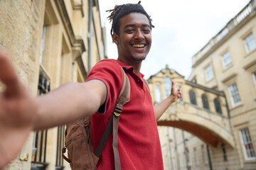 Young Man Travelling On Vacation Taking Selfie Sightseeing In Oxford By Bridge Of Sighs