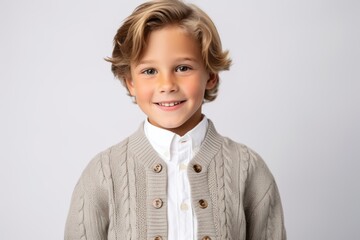 Portrait of a cute little boy with blond hair on white background