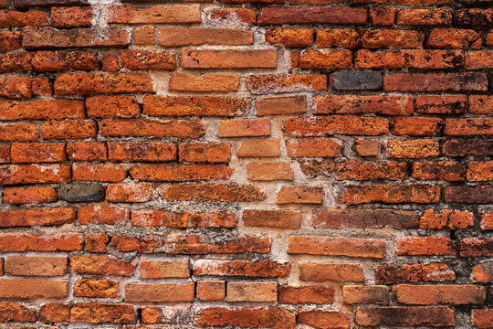 Red brick wall texture background High resolution clear imprinted concrete for editing text on blank spaces, backdrops, banners, abstracts.