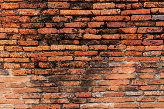 Red brick wall texture background High resolution clear imprinted concrete for editing text on blank spaces, backdrops, banners, abstracts.