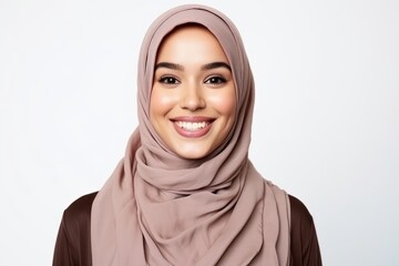 Portrait of beautiful asian muslim woman wearing hijab smiling at camera