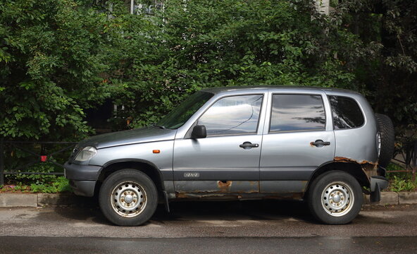Old rusty silver Russian jeep with a short wheelbase, 4x4, auto, automobile, camouflage, car, chevrolet, city, classic, design, jeep, lada, niva, niva chevrolet, old, road, russia, russian, russian je