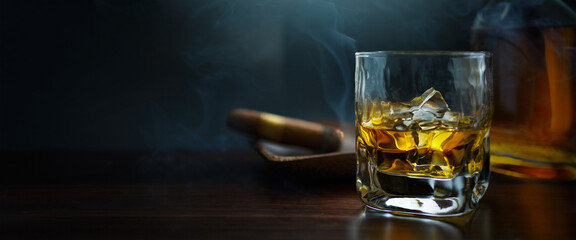 a whiskey glass, cigar and bottle; luxurious men's club banner background with copy space