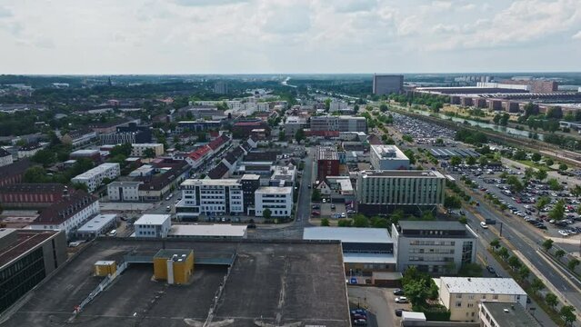 Drone shot of Wolfsburg city , Germany . It's known as the headquarters for Volkswagen and for the Autostadt, an automobile-themed park with a classic-car museum and driving track.