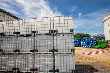 The stock of plastic barrels for the chemical industry. white plastic containers. Chemical industry.