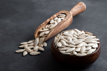 A bowl full of pumpkin seeds,top view 