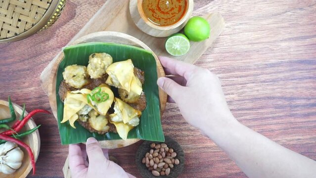 Fried bakso and tofu or Batagor is a traditional food from Indonesia made of fish tapioca seasoning dumplings spicy peanut sauce