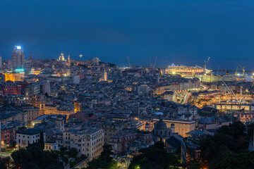 Fototapeta na wymiar a view of genoa city during the evening with open