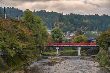 Takayama Japan, autumn landscape foliage at red Nakabashi bridge and Miyakawa river