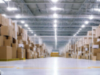 Blurred  A warehouse where the goods are packed in a large number of brown cardboard boxes.