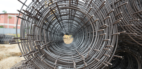 Stainless Steel wire Rolls in construction site.Closeup of wire mesh Metal Steel reinforced rod for concrete in store.Construction Concept-banner image.