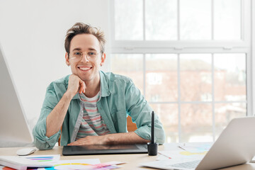 Portrait of male graphic designer in office