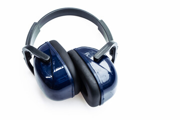 Blue noise protection earmuffs laying on white background, safety equipment
