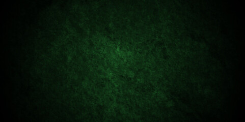 Green wall background with grunge texture, watercolor painted mottled green background, colorful bright ink and watercolor textures on black paper background.