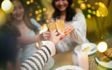 Group of friends celebrating with champagne  Close up on hands.